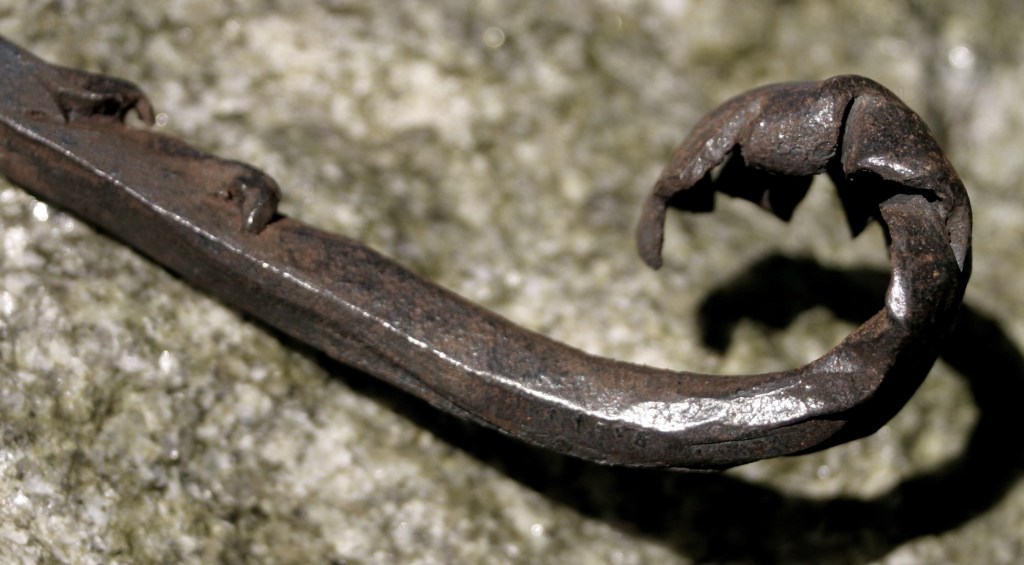 Forged unfurling leaf.