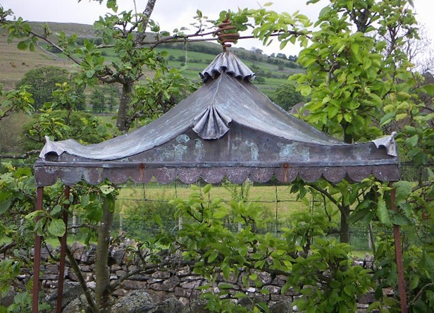Copper and lead-roofed garden pavillion.